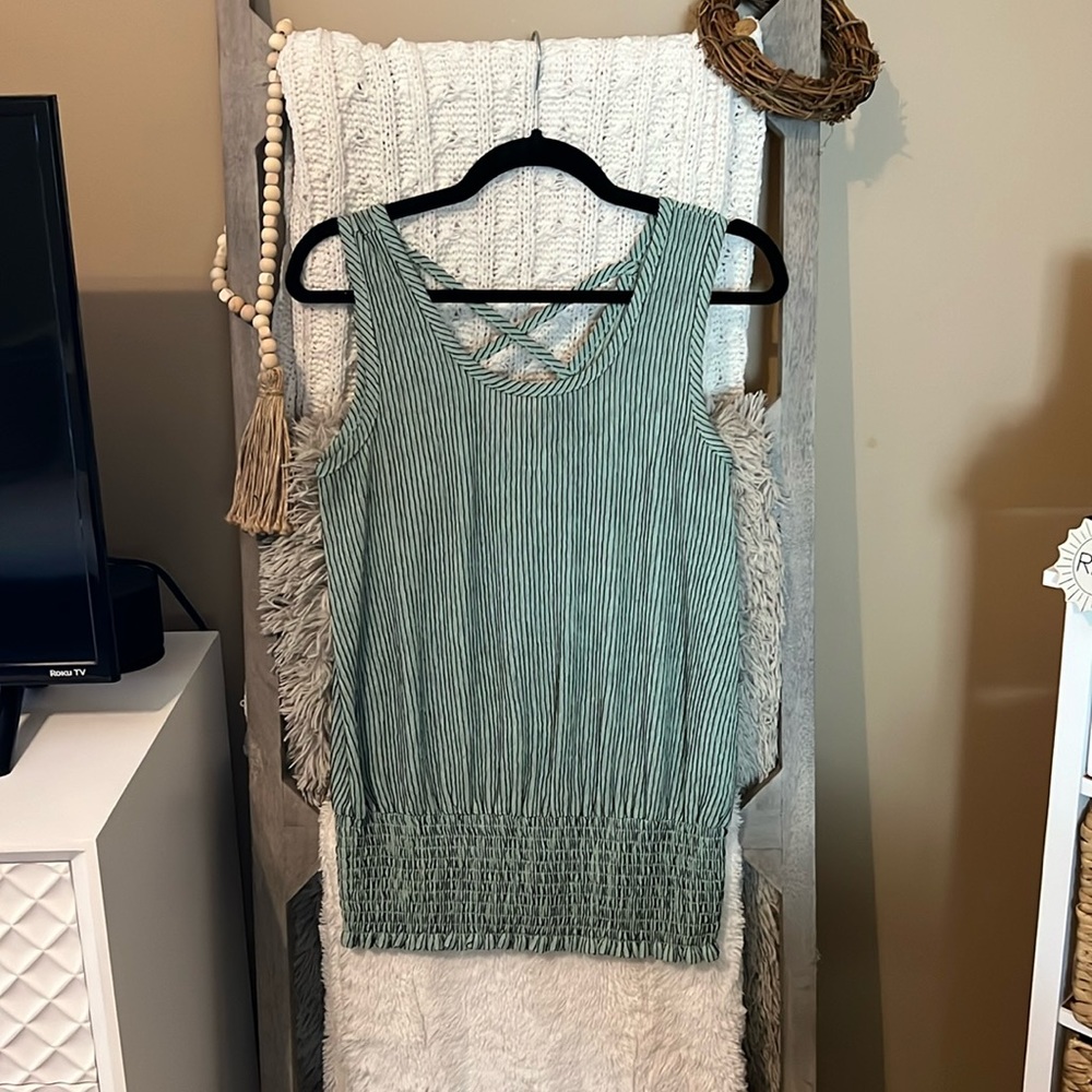 This cinched at the bottom super cute tank is perfect for summer vacation.